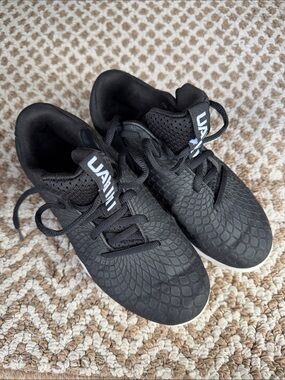 Black Textured Athletic Cleats with White Logo